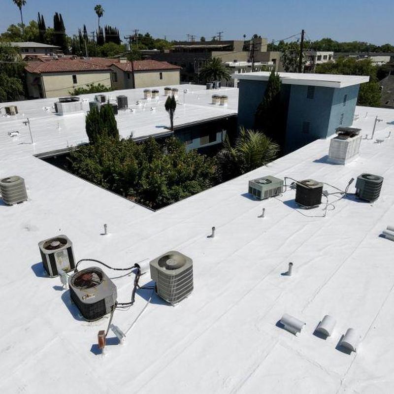 Commercial flat roof with HVAC units and vents Commercial flat roof with HVAC units and vents