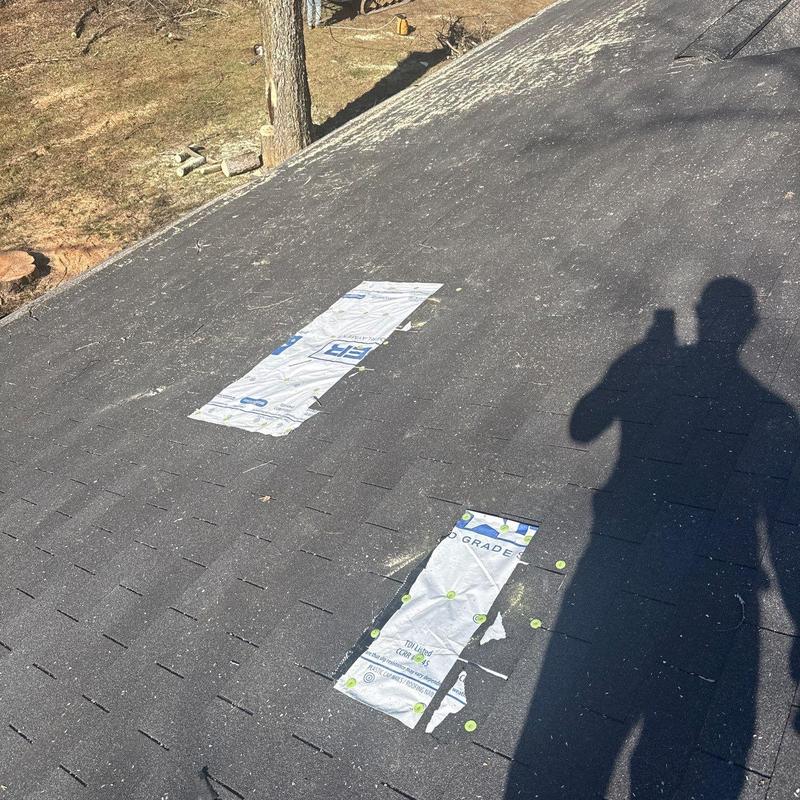 Roof shingles with hail damage and patch repairs