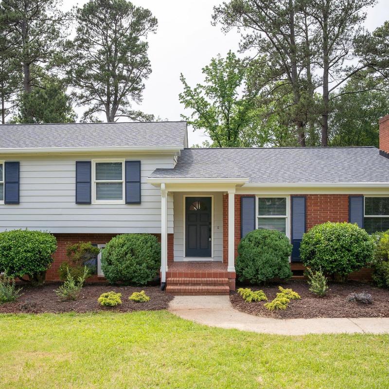 Roof replacement on brick and siding home facade Roof replacement on brick and siding home facade
