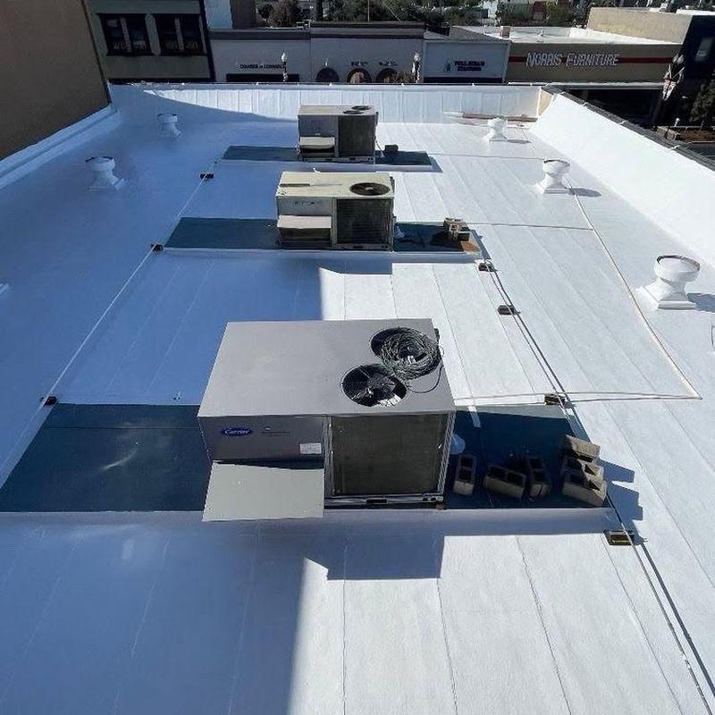 Commercial rooftop HVAC units on white roof membrane Commercial rooftop HVAC units on white roof membrane