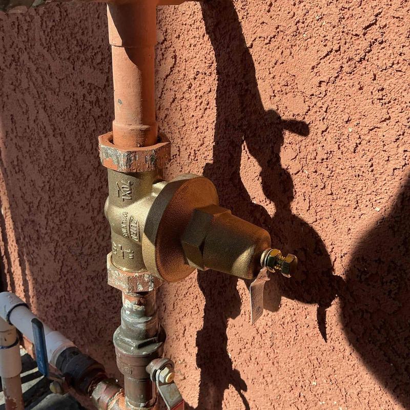 1-inch pressure regulator with copper piping installed outdoors