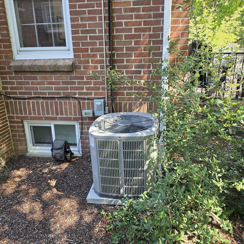 American Standard air conditioner unit outside home