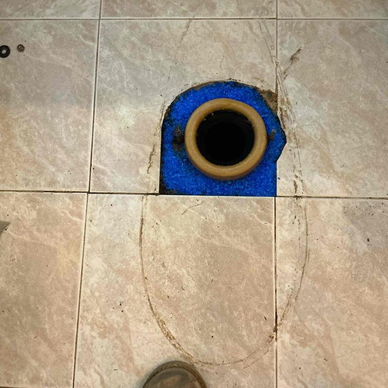 Toilet flange and wax ring on tiled floor installation
