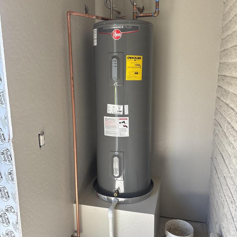 Water heater with copper piping in utility closet