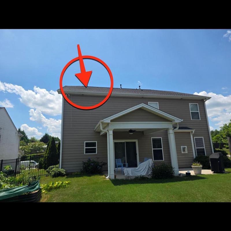 House roof shingles with leak inspection arrow