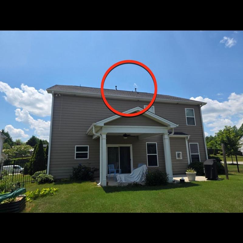Roof shingles with nail pops circled for repair