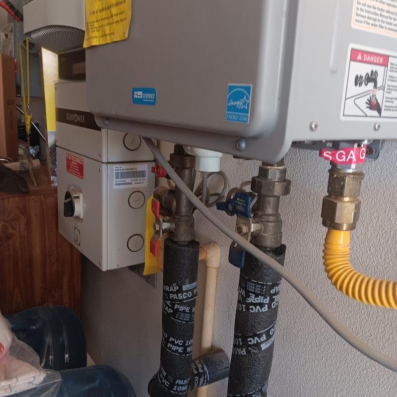 Tankless water heater piping and gas connection