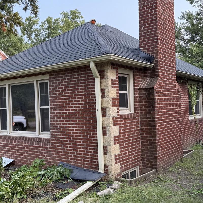 Tamko Titan XT Class 3 shingles on brick house roof Tamko Titan XT Class 3 shingles on brick house roof