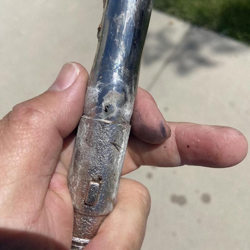 Outdoor hose faucet with visible corrosion and damage Outdoor hose faucet with visible corrosion and damage