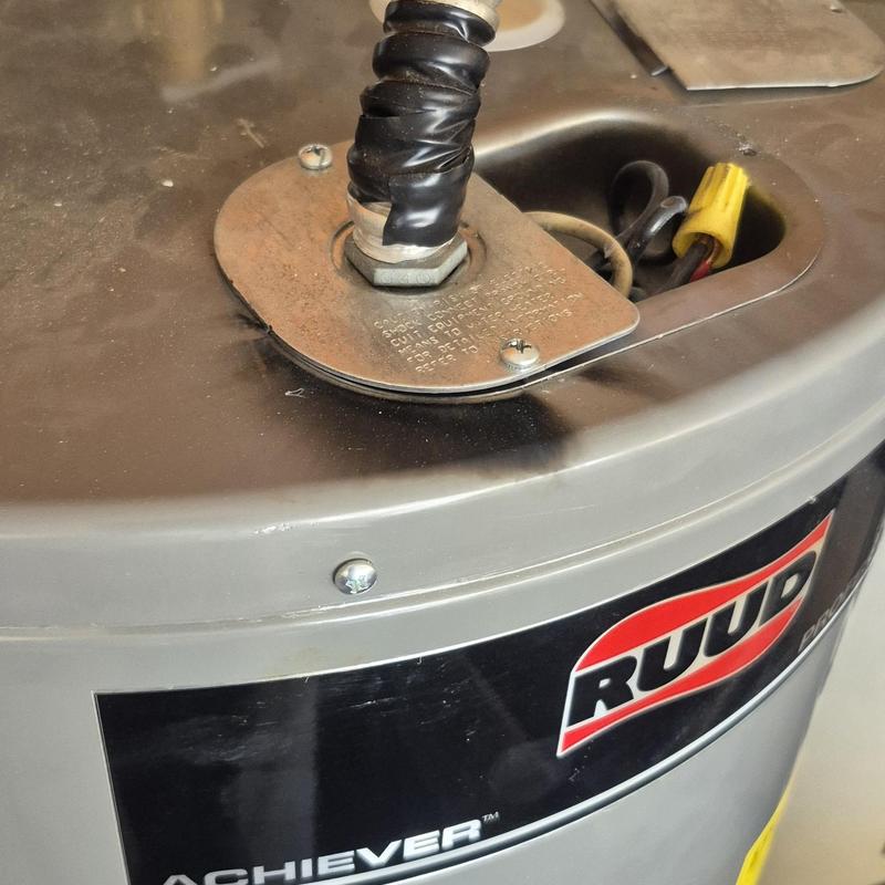 Water heater with electrical wiring connection and cover plate