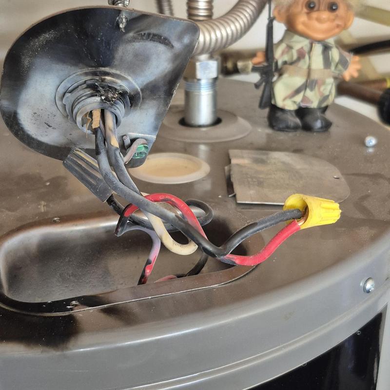 Water heater damaged wiring and connectors close-up