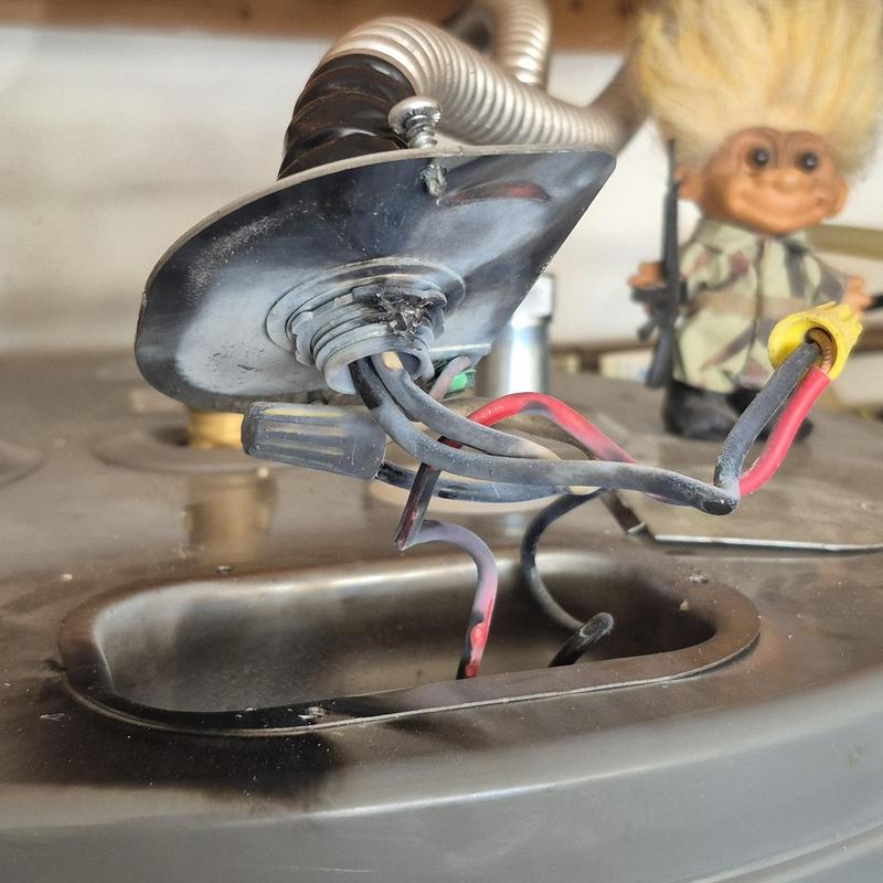 Water heater wiring with burnt connection and corrosion