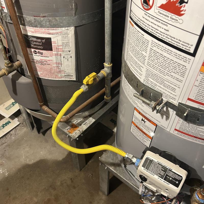 40-gallon water heater with yellow gas line connection