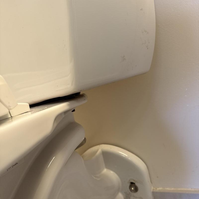 Toilet tank and bowl gasket seal adjustment