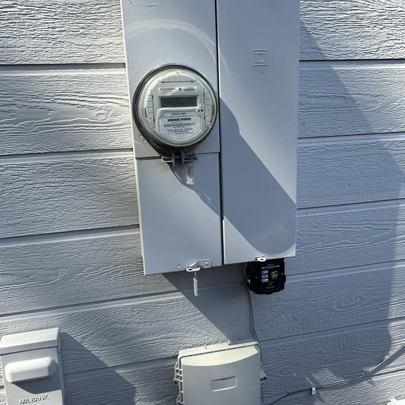 Electrical meter and panel with surge protector installed Electrical meter and panel with surge protector installed