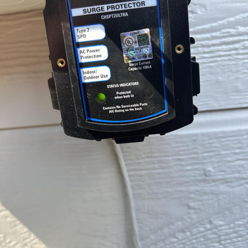 Surge protector device with status indicator light installed Surge protector device with status indicator light installed
