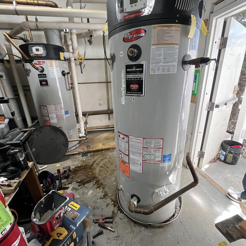 Commercial high efficiency water heater installation in utility room Commercial high efficiency water heater installation in utility room