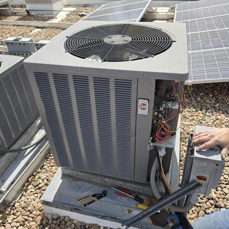 Rheem air conditioner with new disconnect and capacitor