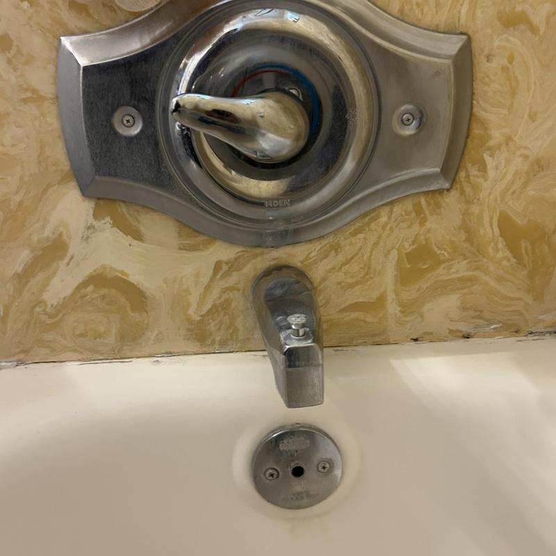 Shower valve and tub spout with wall mounting plate