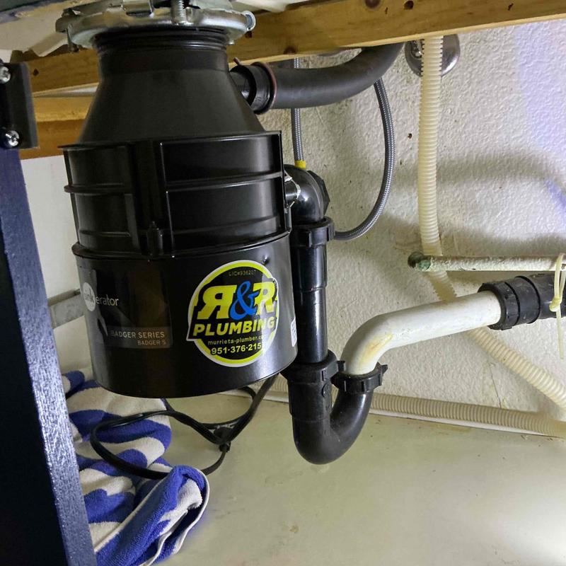 Garbage disposal unit with plumbing connections