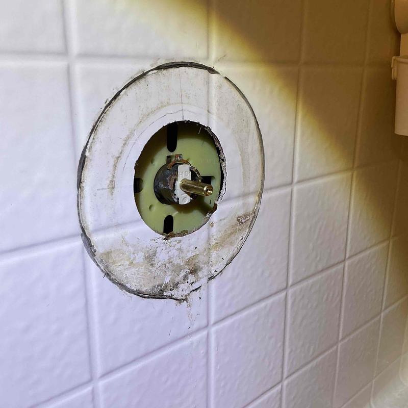 Shower valve cartridge removal from tiled wall
