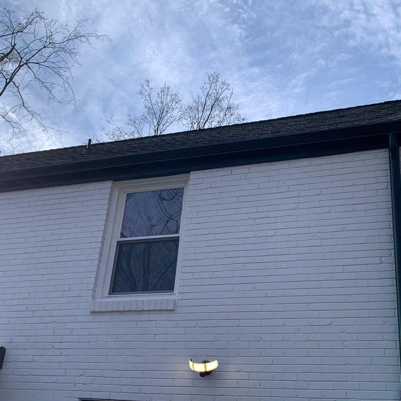 Asphalt shingle roof with visible weather damage