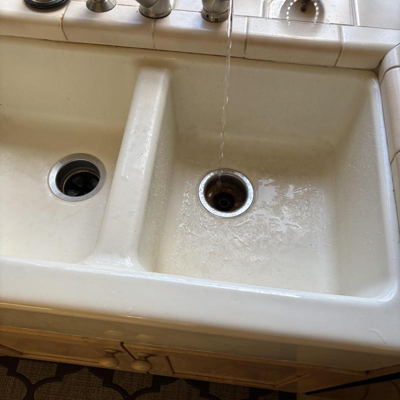 Kitchen sink drain with running water and disposal hole Kitchen sink drain with running water and disposal hole