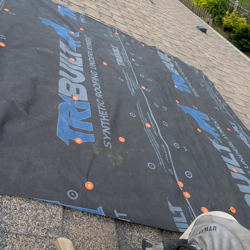 Synthetic roofing underlayment installation on shingle roof
