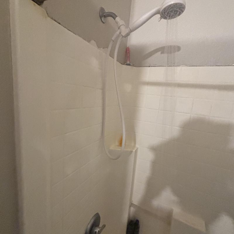 Tub spout and shower plate caulking with leak test Tub spout and shower plate caulking with leak test
