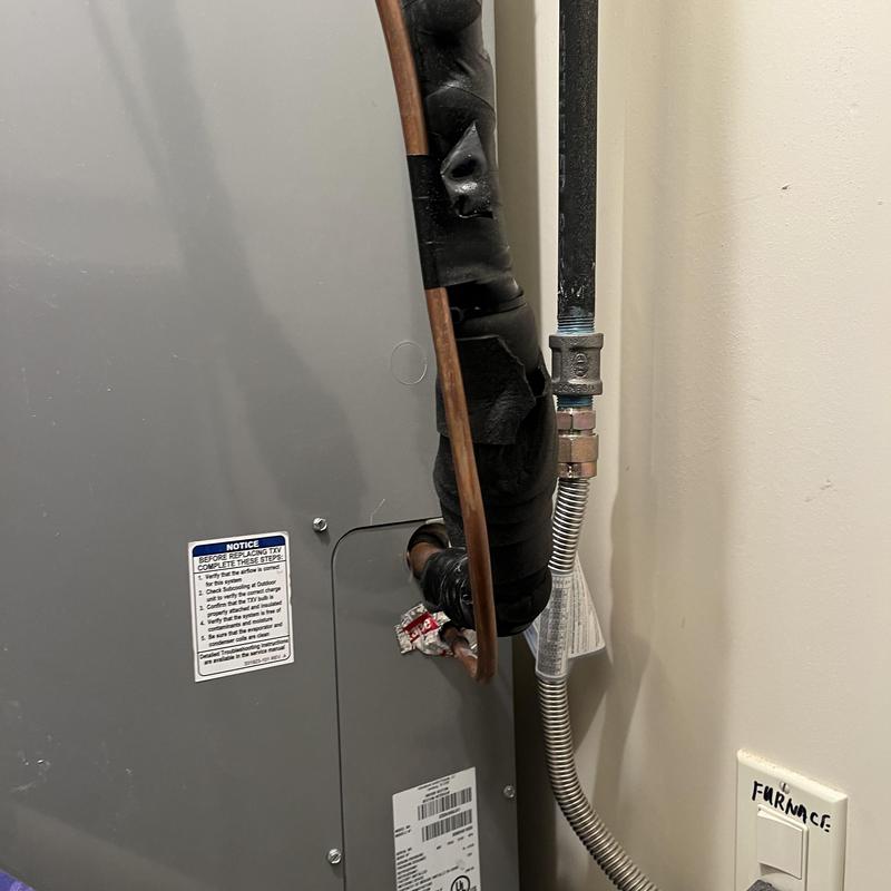 HVAC furnace copper refrigerant line with insulation wrap HVAC furnace copper refrigerant line with insulation wrap