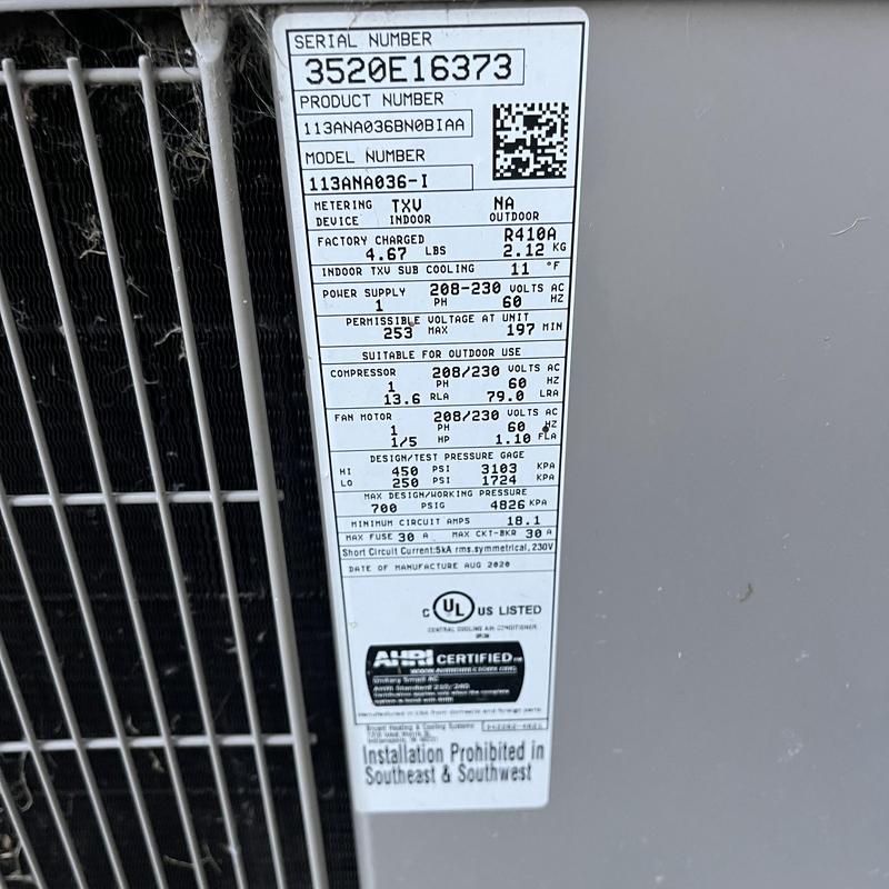 HVAC system serial and specifications label close-up HVAC system serial and specifications label close-up