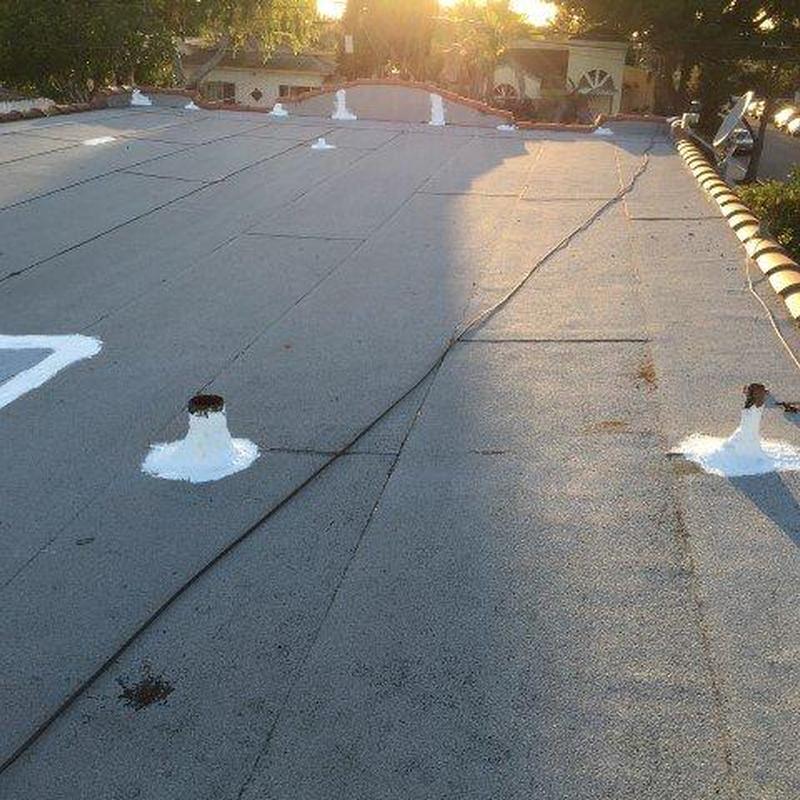 Flat roof with sealed vent pipes at sunrise Flat roof with sealed vent pipes at sunrise
