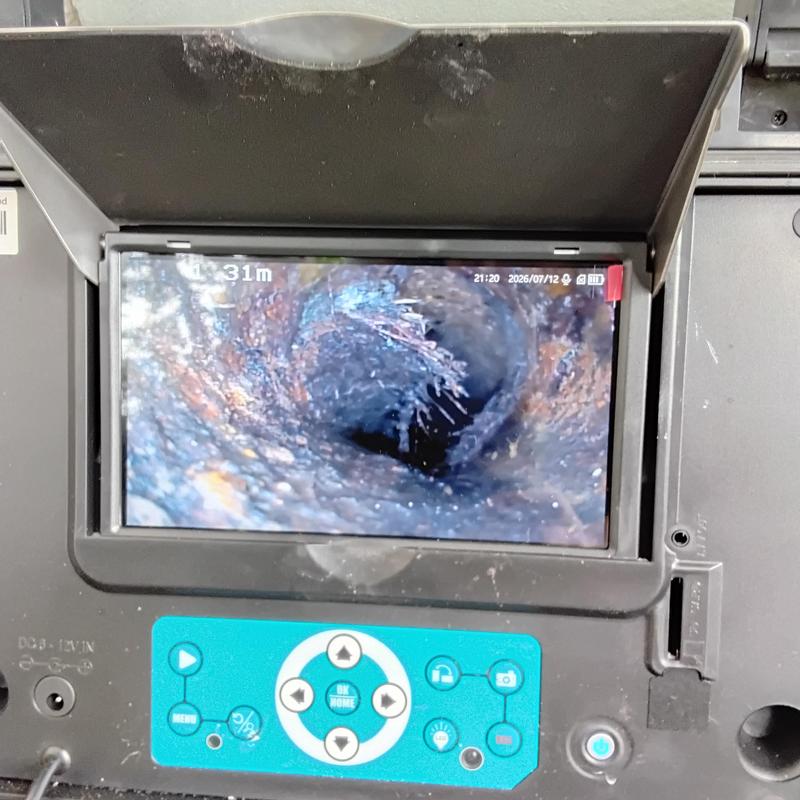 Cast iron pipe camera inspection showing root intrusion