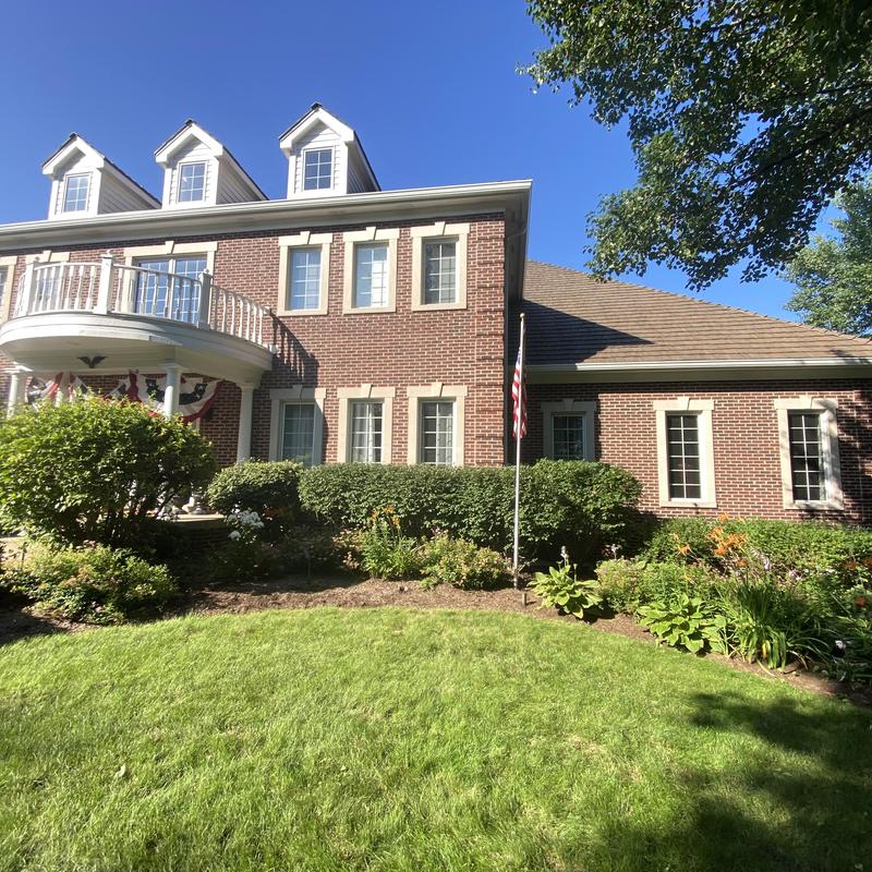 Oversized gutters and downspouts with guards