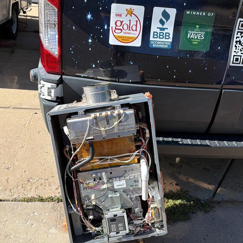 Tankless water heater unit removed by truck Tankless water heater unit removed by truck
