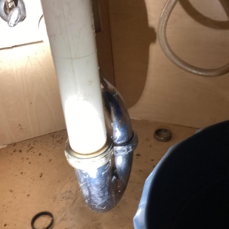 Kitchen sink drain pipe with metal trap under cabinet Kitchen sink drain pipe with metal trap under cabinet