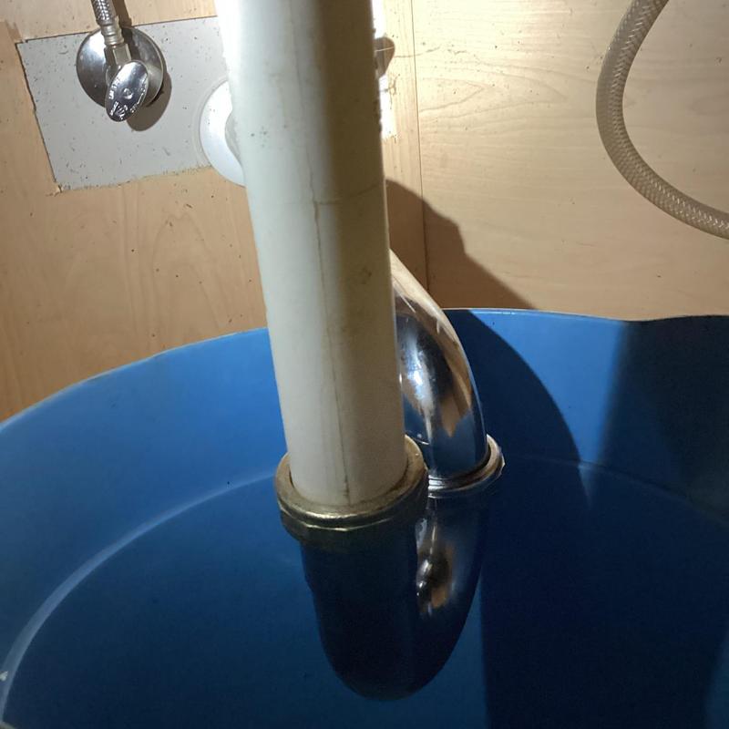 Kitchen sink drain pipe with bucket below Kitchen sink drain pipe with bucket below