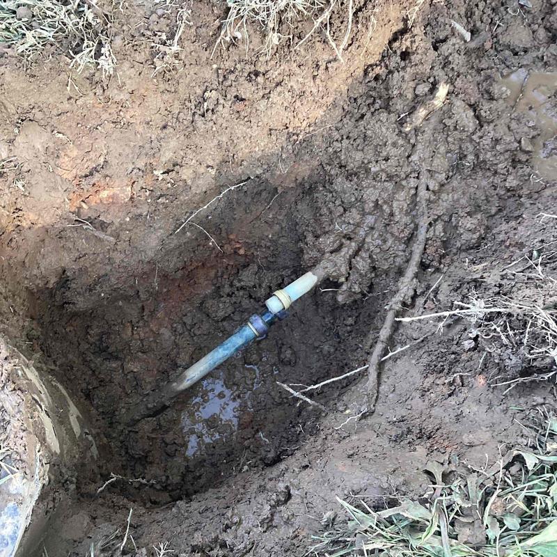 Water supply pipe with shark bite connector in dug soil hole Water supply pipe with shark bite connector in dug soil hole