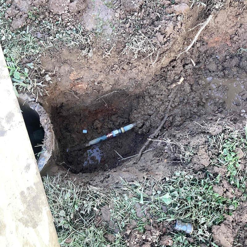 Water supply line with repaired shark bite fitting in yard hole Water supply line with repaired shark bite fitting in yard hole