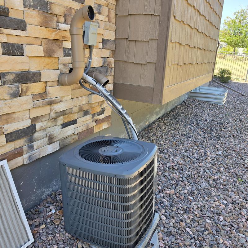 Goodman GSX130361EF air conditioner unit outdoors