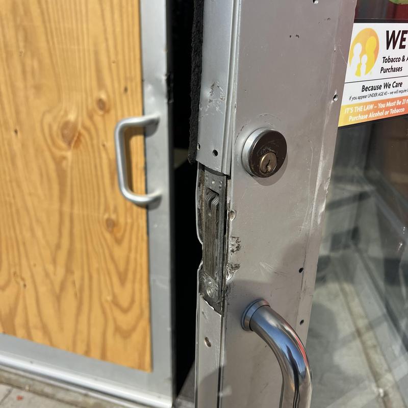 Door lock and latch with metal handle on storefront door