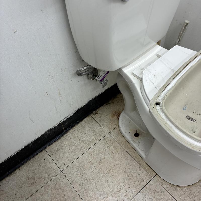 Toilet valve and flexible supply line installation near floor Toilet valve and flexible supply line installation near floor
