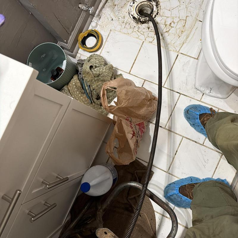 Toilet drain line with plumbing cable in bathroom floor Toilet drain line with plumbing cable in bathroom floor