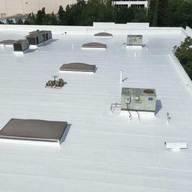 White commercial roof membrane with HVAC units White commercial roof membrane with HVAC units