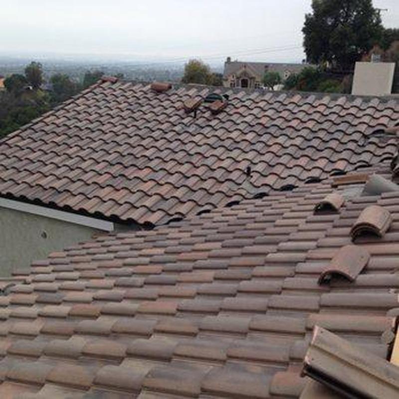Tile roof with loose tiles during inspection in Monrovia Tile roof with loose tiles during inspection in Monrovia