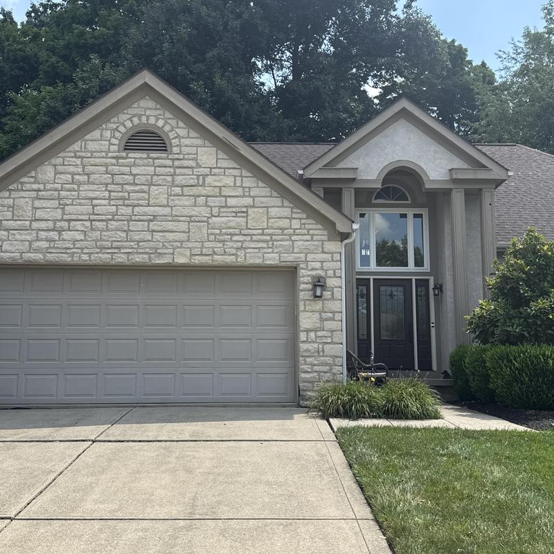 Stone garage exterior with roof inspection Stone garage exterior with roof inspection