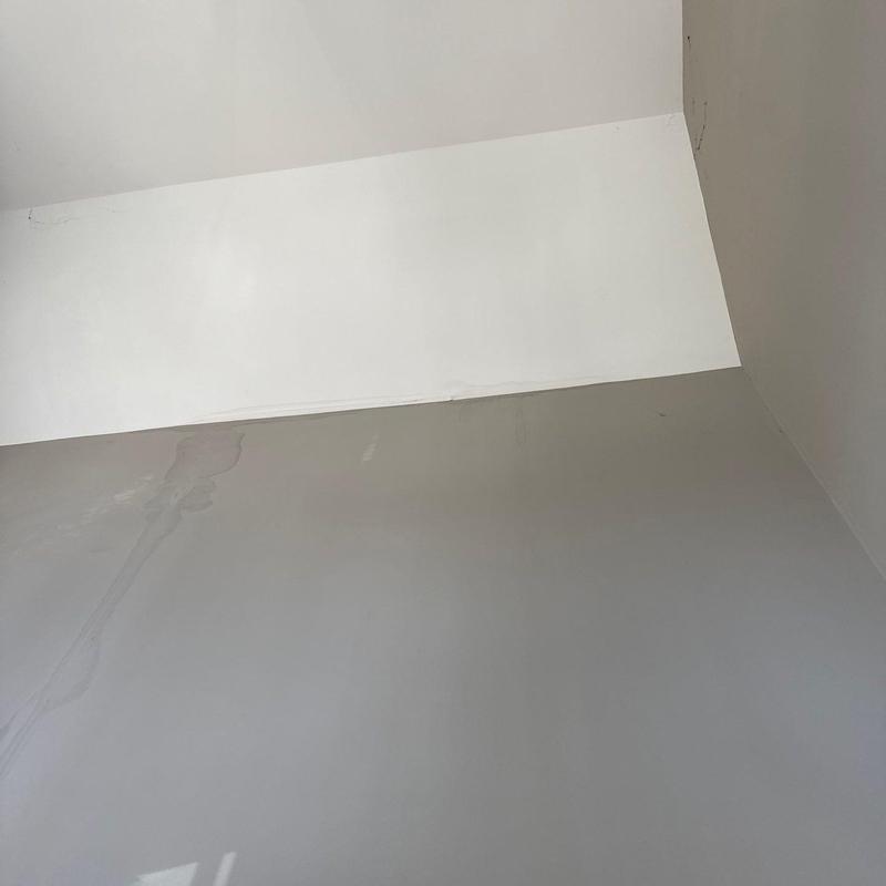 Ceiling drywall with water stains and cracks