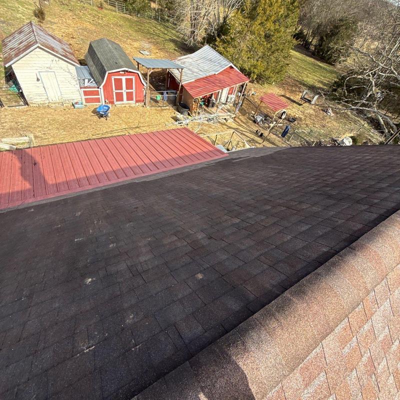 Shingle roof inspection showing hail damage and flashing