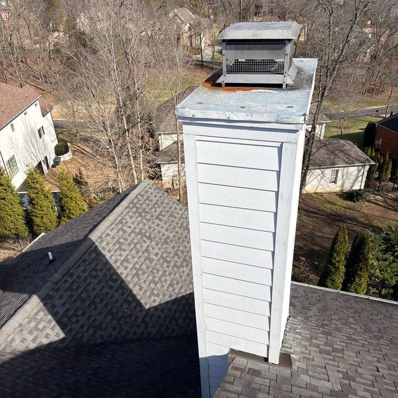 Roof chimney flashing and shingle inspection with hail damage