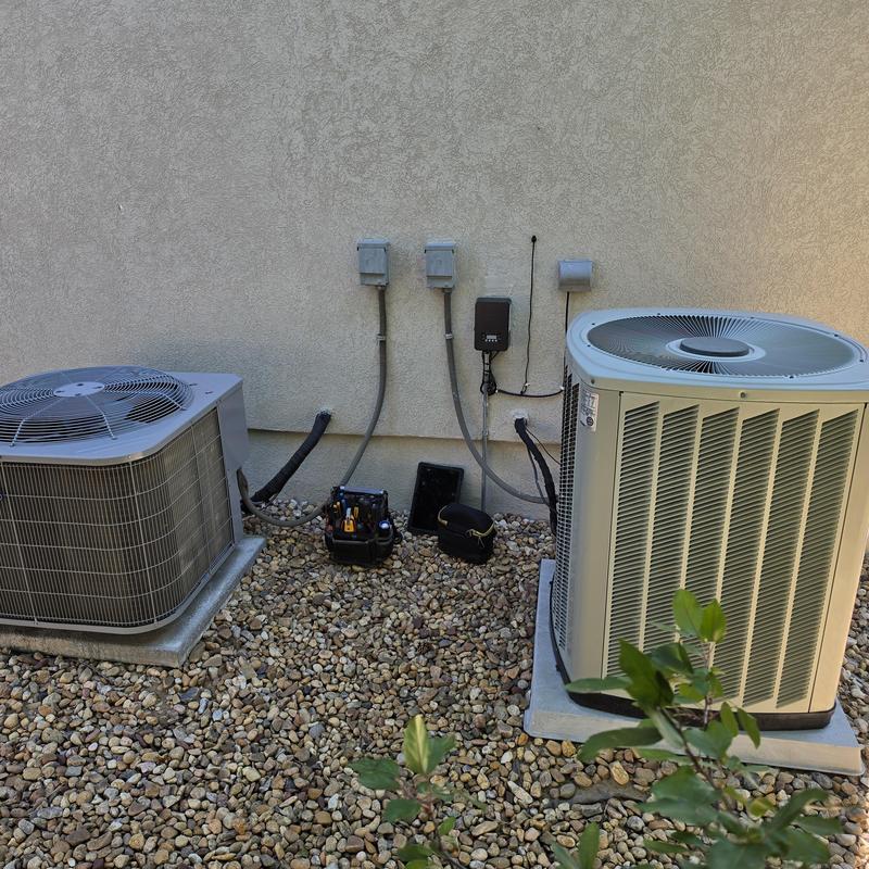 Trane and Carrier air conditioner units with service tools